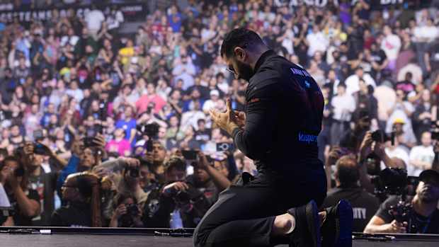 AngryBird kneels in prayer after winning Evo 2023